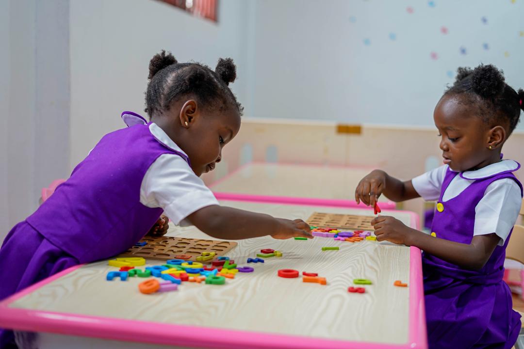 Children explore letters, numbers, color, and shape through play.