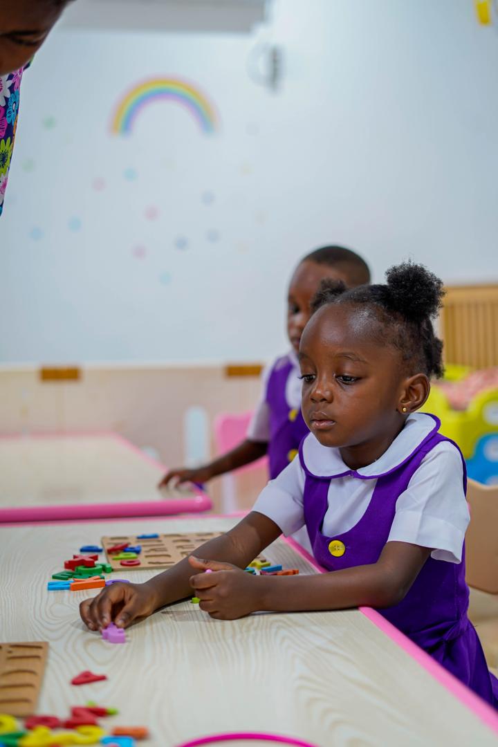 A Brightmore learner working at a classroom table