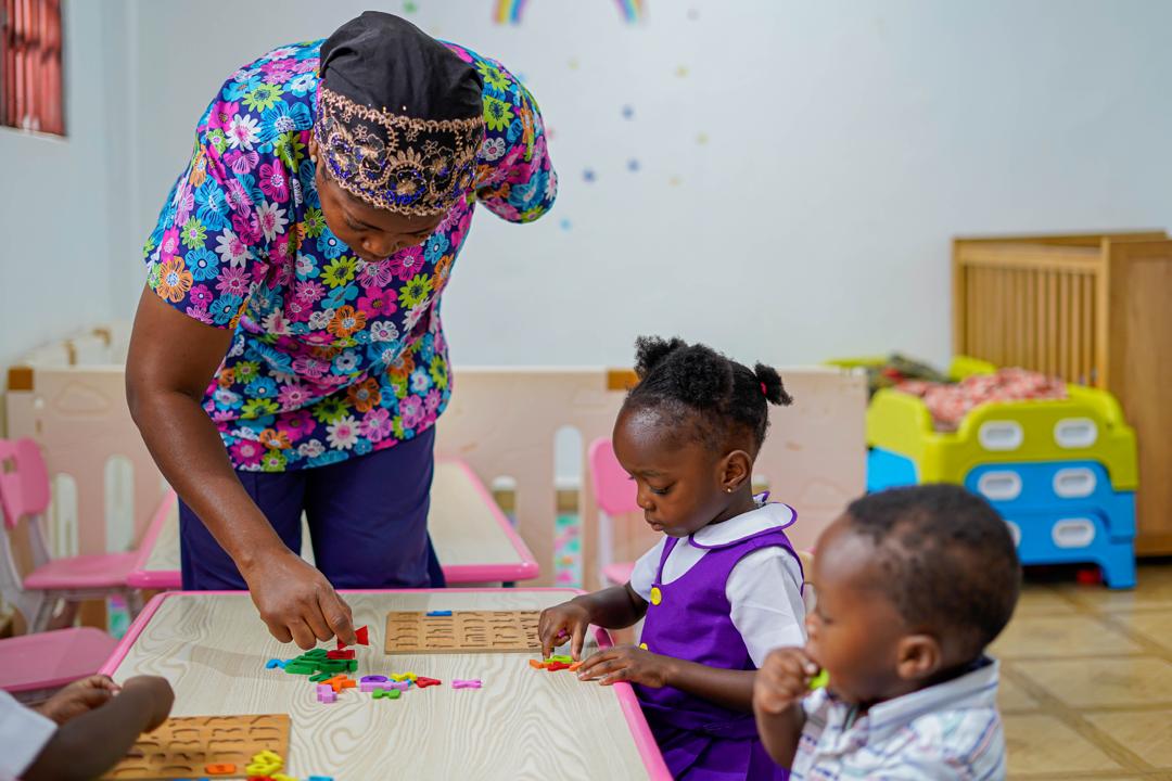 Brightmore teacher guiding learners during a table activity